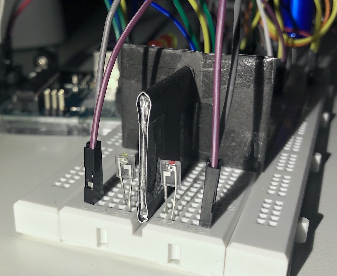 Electrical components on a breadboard to create a light sensor.